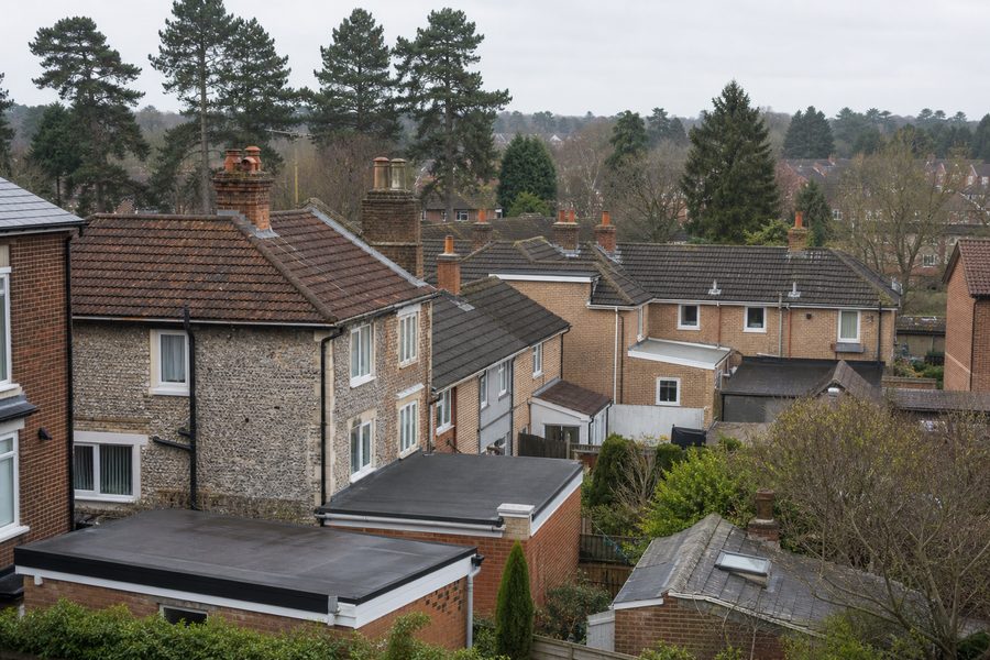 Thetford homes with a mix of tiled, slate and flat roof sections near the river town centre